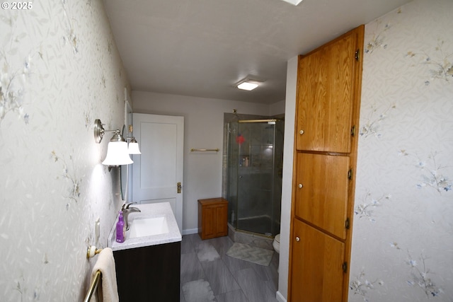 609 E 10th St, The Dalles, OR 97058 - full bathroom with vanity, a stall shower, toilet, and wallpapered walls