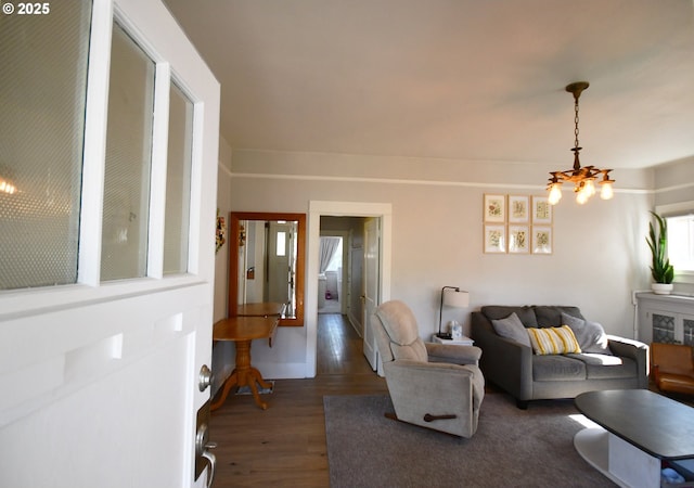 609 E 10th St, The Dalles, OR 97058 - living area featuring a chandelier and wood finished floors
