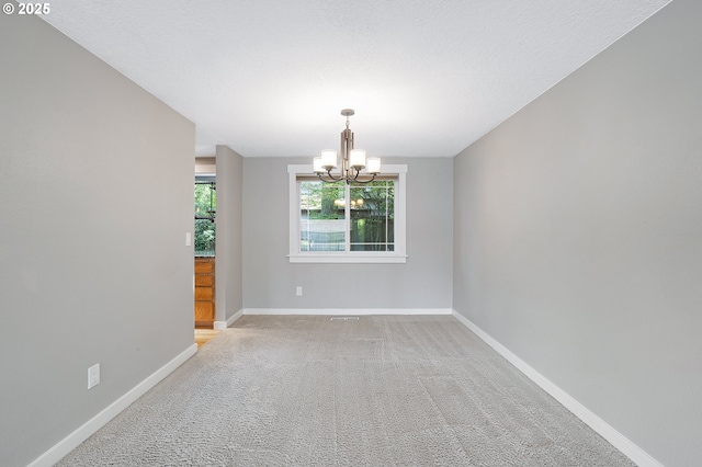 20752 SW 104th Ave, Tualatin, OR 97062 - spare room with a chandelier and light colored carpet