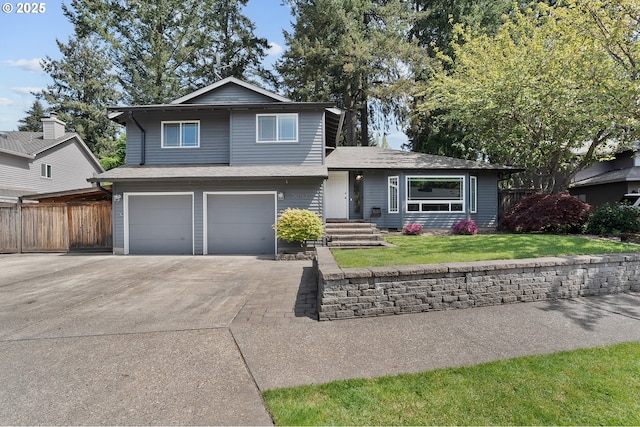 20752 SW 104th Ave, Tualatin, OR 97062 - tri-level home with an attached garage, driveway, and roof with shingles