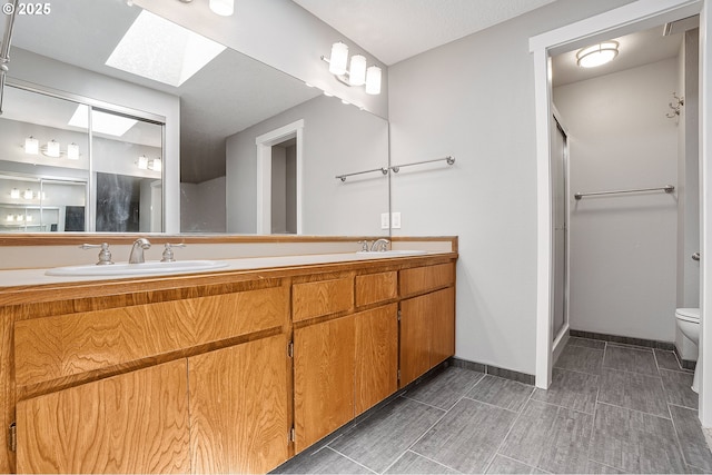 20752 SW 104th Ave, Tualatin, OR 97062 - bathroom with a skylight, double vanity, and a stall shower