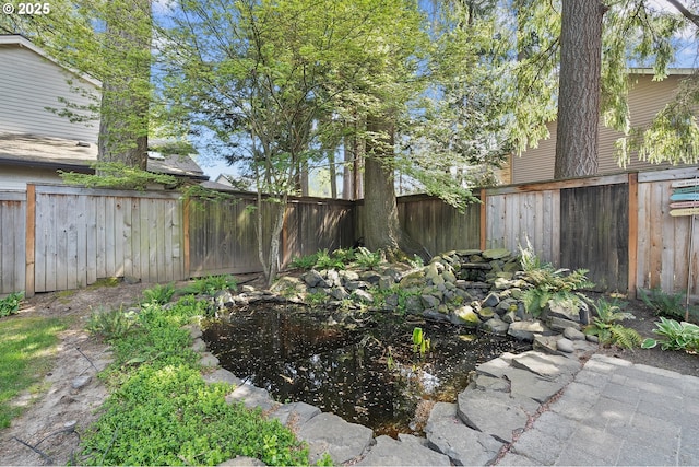 20752 SW 104th Ave, Tualatin, OR 97062 - fenced backyard featuring a small pond