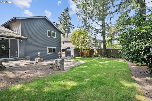 20752 SW 104th Ave, Tualatin, OR 97062 - rear view of house with a storage unit, a patio area, and a chimney