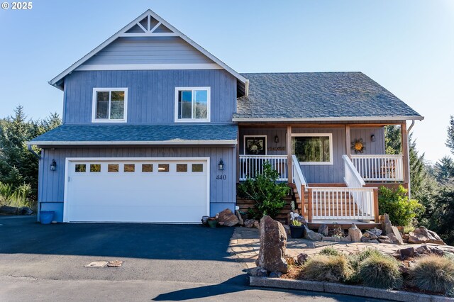 view of front of house with a garage and covered porch