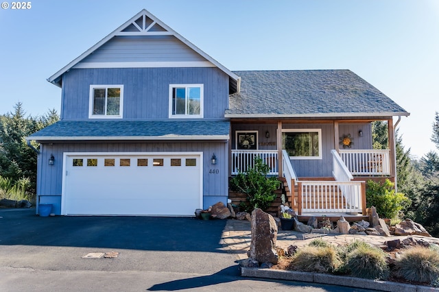 view of front of property with a garage and covered porch