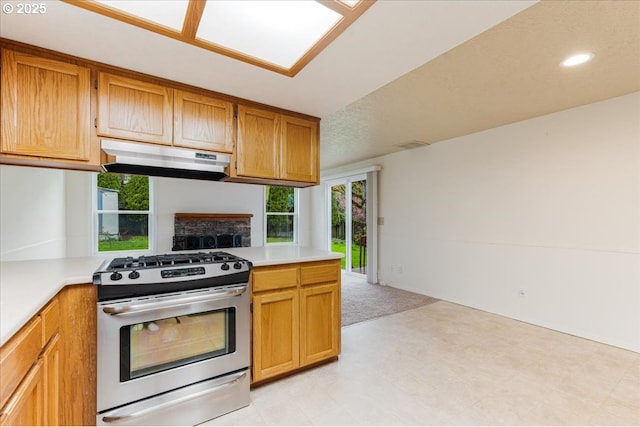11347 SE Abby Ln, Clackamas, OR 97015 - kitchen with gas range, under cabinet range hood, light countertops, healthy amount of natural light, and recessed lighting