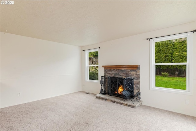 11347 SE Abby Ln, Clackamas, OR 97015 - unfurnished living room featuring a fireplace, carpet, and a textured ceiling