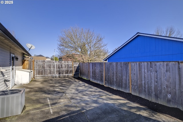 view of patio featuring central AC unit and a fenced backyard