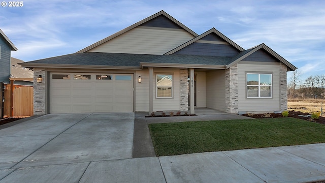 view of front of home featuring a garage and a front lawn