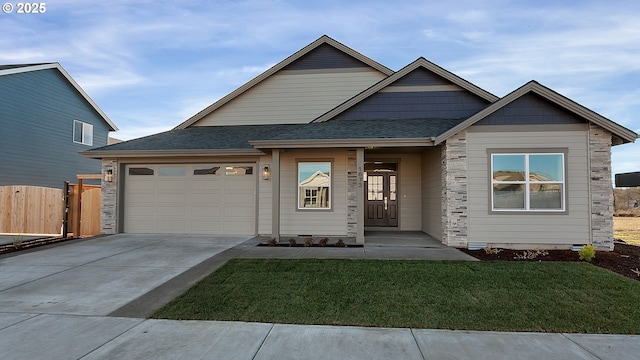 view of front facade featuring a garage and a front lawn