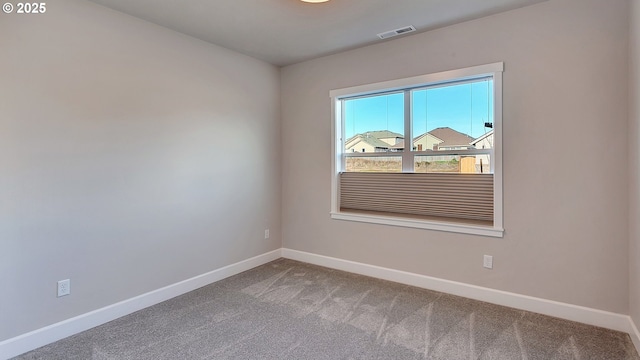 unfurnished room featuring carpet flooring