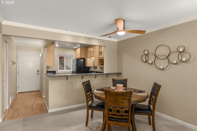 5050 S Landing Dr Unit 202, Portland, OR 97239 - dining room featuring baseboards, ornamental molding, ceiling fan, light colored carpet, and recessed lighting