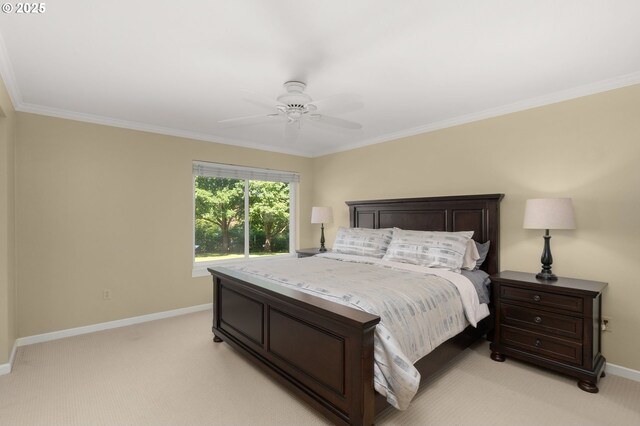 5050 S Landing Dr Unit 202, Portland, OR 97239 - bedroom with baseboards, light colored carpet, crown molding, and a ceiling fan