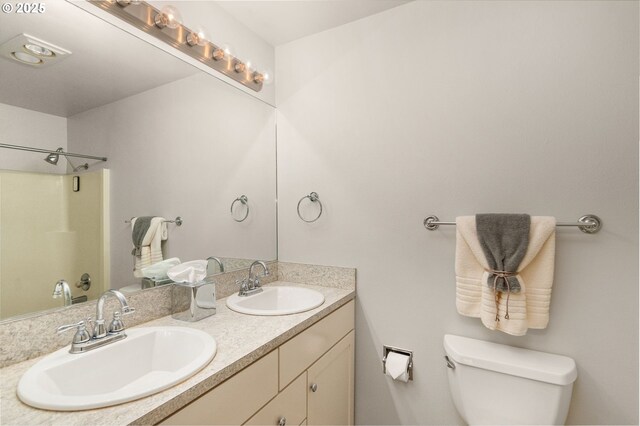 5050 S Landing Dr Unit 202, Portland, OR 97239 - full bathroom featuring toilet, double vanity, and a shower