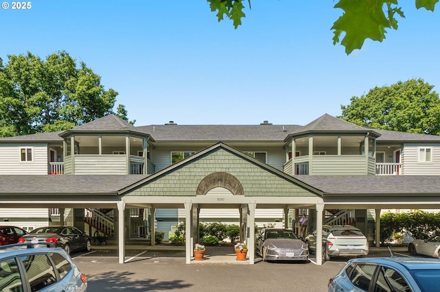 5050 S Landing Dr Unit 202, Portland, OR 97239 - view of property featuring covered parking and stairway