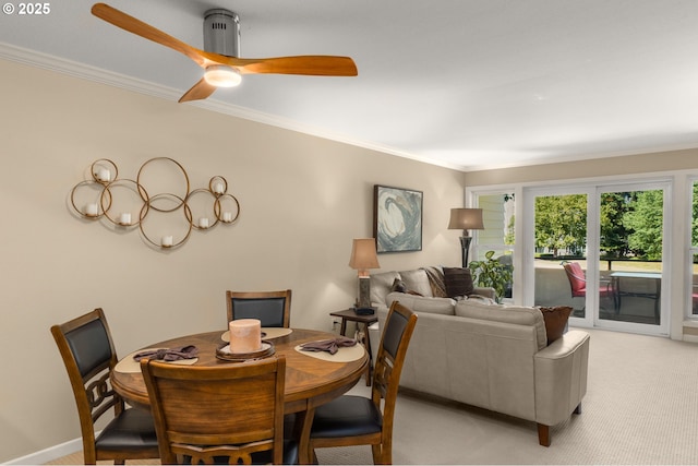5050 S Landing Dr Unit 202, Portland, OR 97239 - dining room featuring ornamental molding, light carpet, and ceiling fan