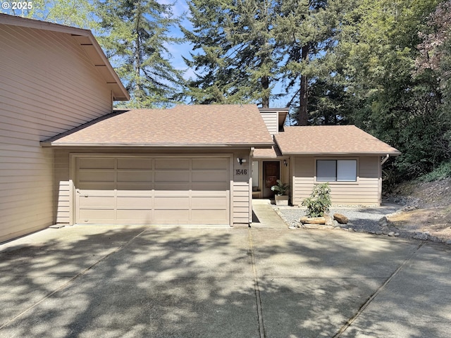 1546 Seacrest Ln, Brookings, OR 97415 - view of front of property featuring a garage, a shingled roof, and driveway
