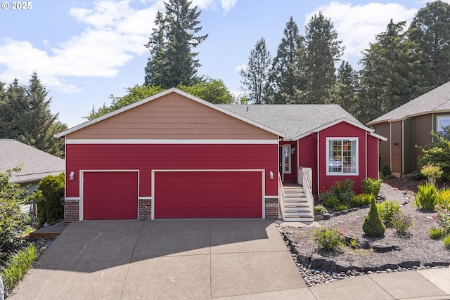 16952 SE Dunhill Loop, Damascus, OR 97089 - view of front of house featuring a garage, driveway, and brick siding