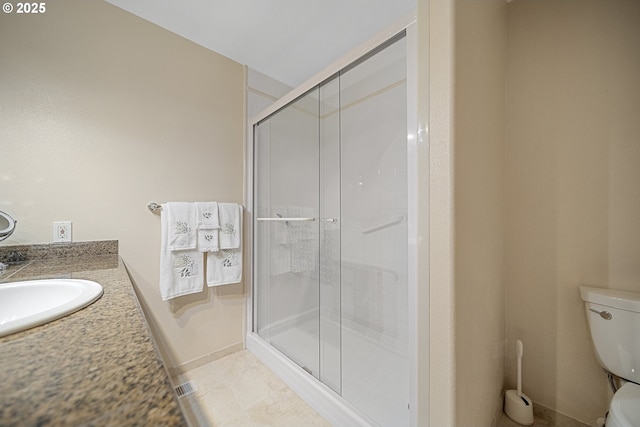 16952 SE Dunhill Loop, Damascus, OR 97089 - bathroom featuring a stall shower, vanity, and tile patterned flooring