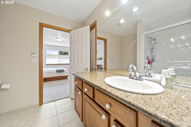 16952 SE Dunhill Loop, Damascus, OR 97089 - ensuite bathroom featuring vanity, a stall shower, tile patterned flooring, and rail lighting