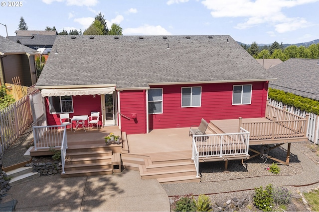 16952 SE Dunhill Loop, Damascus, OR 97089 - back of property with roof with shingles, a fenced backyard, and a wooden deck