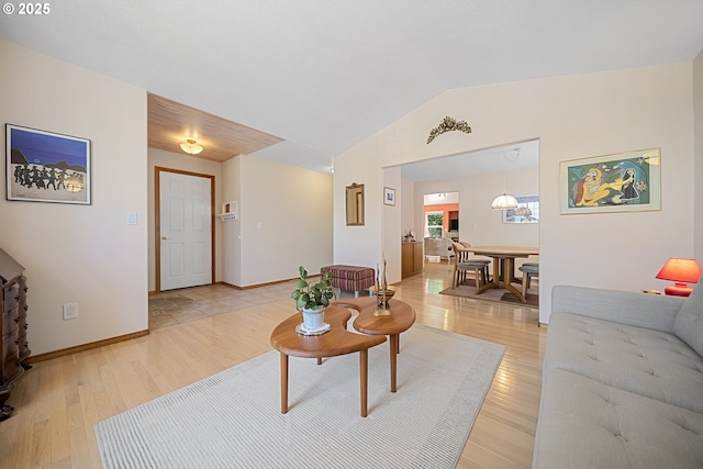 16952 SE Dunhill Loop, Damascus, OR 97089 - living room featuring vaulted ceiling and light wood finished floors