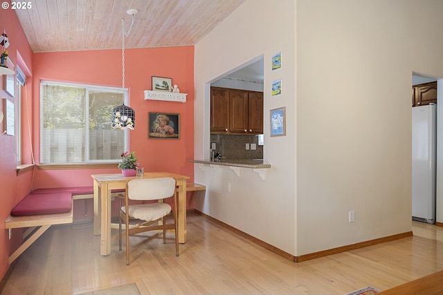 16952 SE Dunhill Loop, Damascus, OR 97089 - dining area featuring light wood-type flooring, lofted ceiling, and wooden ceiling