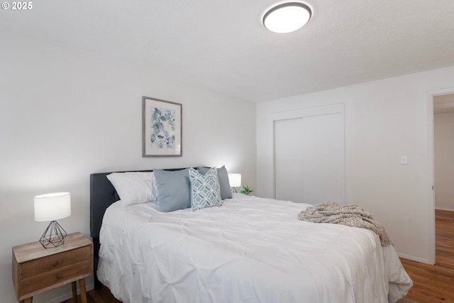 165 NE 167th Pl, Portland, OR 97230 - bedroom with wood finished floors and a closet