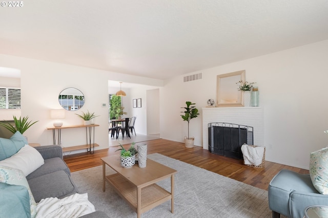 165 NE 167th Pl, Portland, OR 97230 - living area with wood finished floors and a fireplace