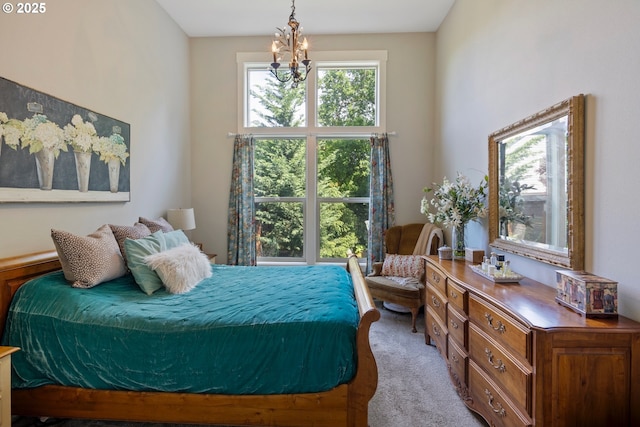 bedroom with carpet and a chandelier