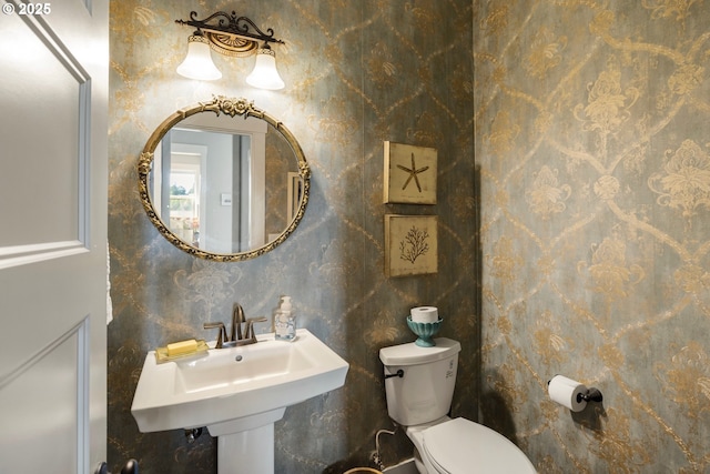 bathroom featuring toilet and a sink