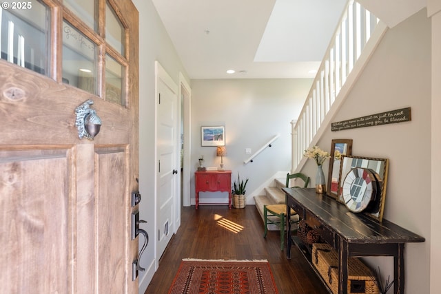 foyer entrance featuring stairway, wood-type flooring, recessed lighting, and baseboards