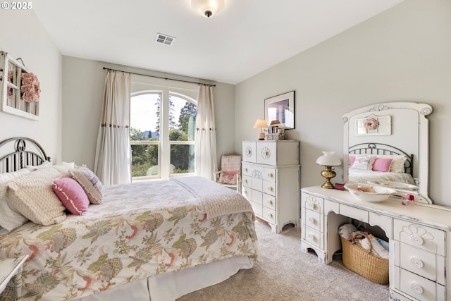 bedroom featuring light colored carpet