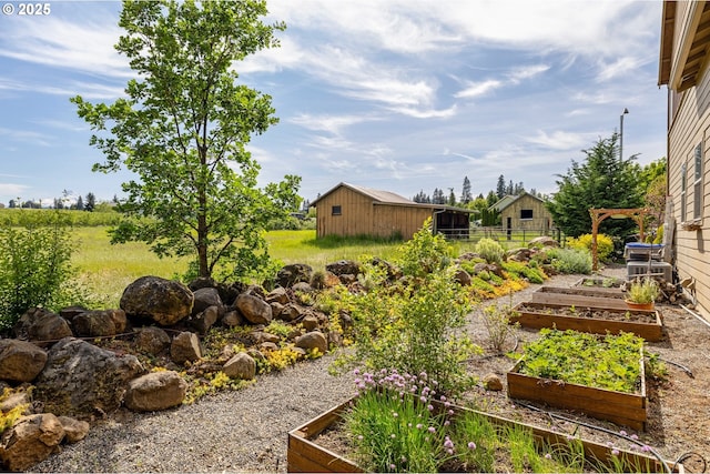 view of yard with a garden and fence