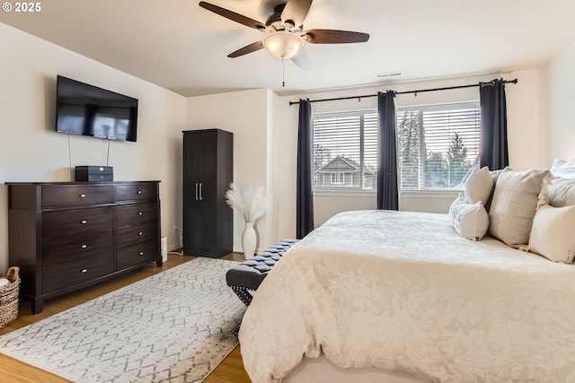 bedroom featuring ceiling fan and wood-type flooring