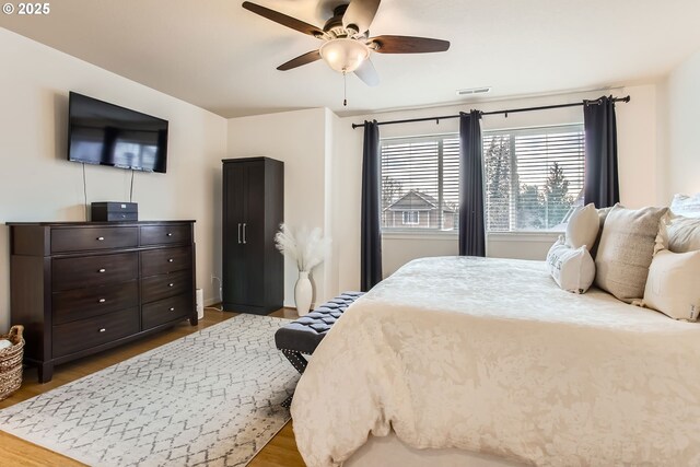 bedroom featuring ceiling fan and wood-type flooring