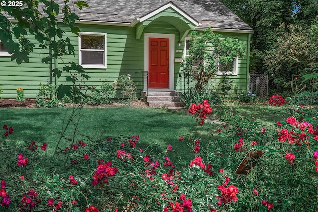 8429 SE Mill St, Portland, OR 97216 - view of front of home with roof with shingles and a front lawn