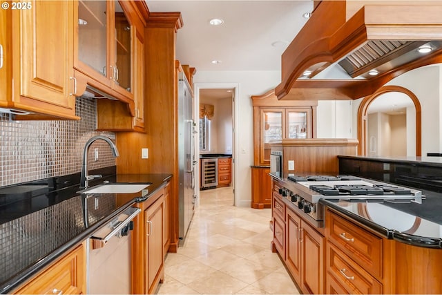 kitchen with dishwasher, a sink, wine cooler, decorative backsplash, and stainless steel gas cooktop