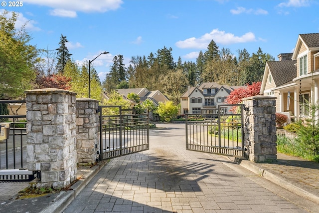 view of gate with a residential view