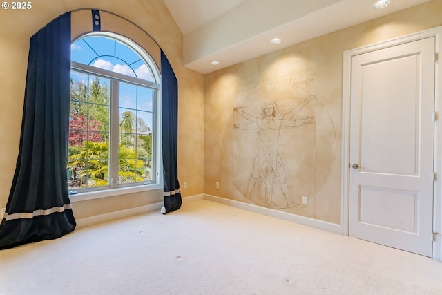 spare room featuring baseboards, lofted ceiling, carpet, and recessed lighting