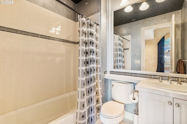 bathroom featuring shower / tub combo, vanity, and toilet