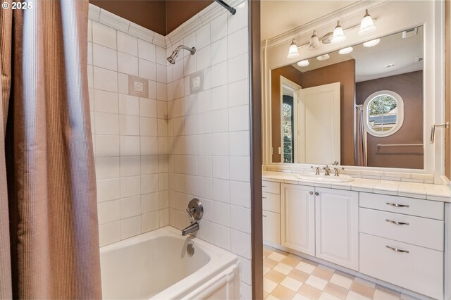 full bath featuring visible vents, shower / bath combo with shower curtain, and vanity