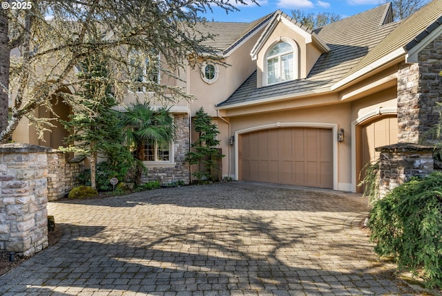 traditional home with stone siding and stucco siding