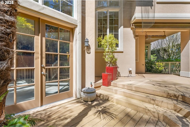 exterior space featuring french doors and stucco siding