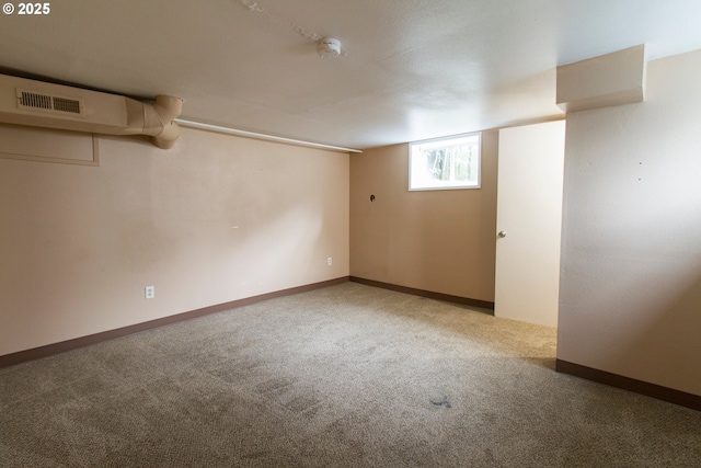 1522 N Rosa Parks Way, Portland, OR 97217 - basement featuring baseboards, visible vents, and carpet flooring