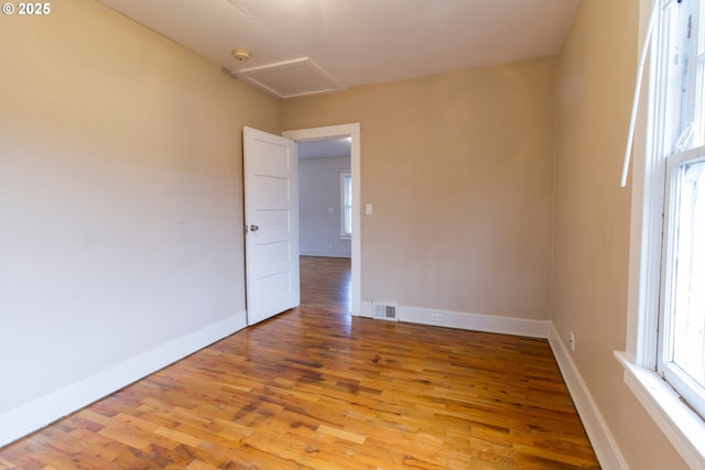 1522 N Rosa Parks Way, Portland, OR 97217 - unfurnished room featuring attic access, light wood-style floors, visible vents, and baseboards