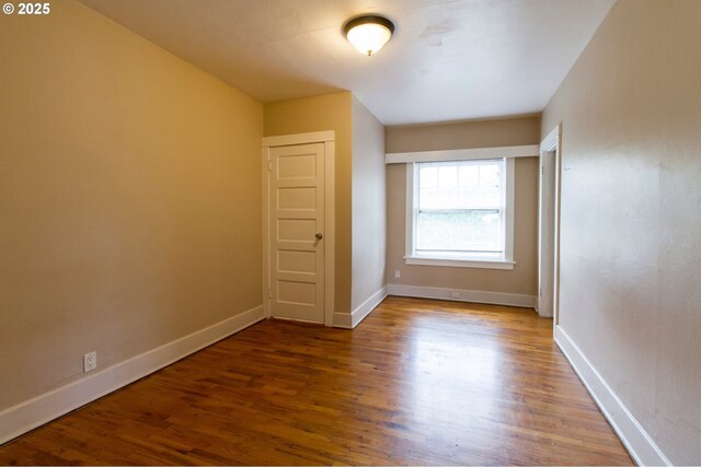 1522 N Rosa Parks Way, Portland, OR 97217 - unfurnished bedroom with wood finished floors and baseboards