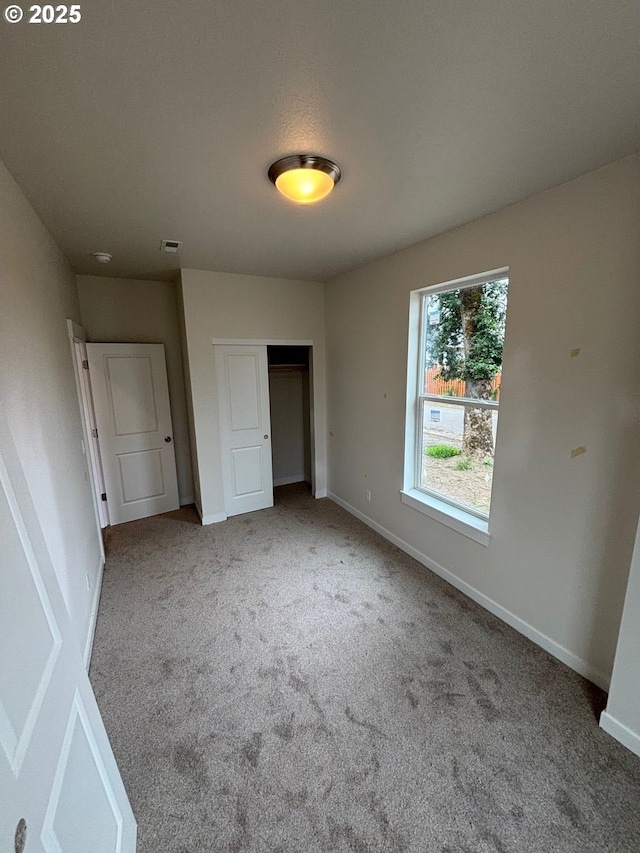 9314 Glory Ct NE, Salem, OR 97305 - unfurnished bedroom with carpet flooring, a closet, and baseboards