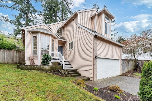 view of front of property featuring driveway, a front yard, a garage, and fence