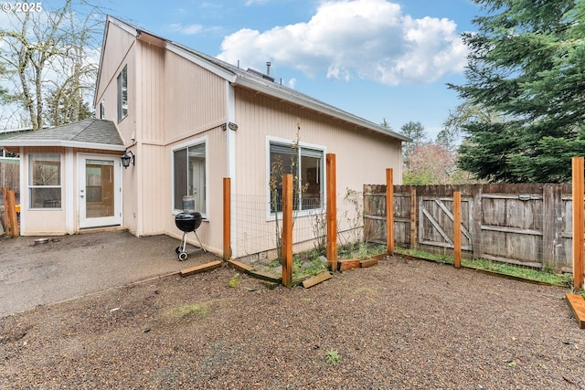 exterior space with a patio and fence